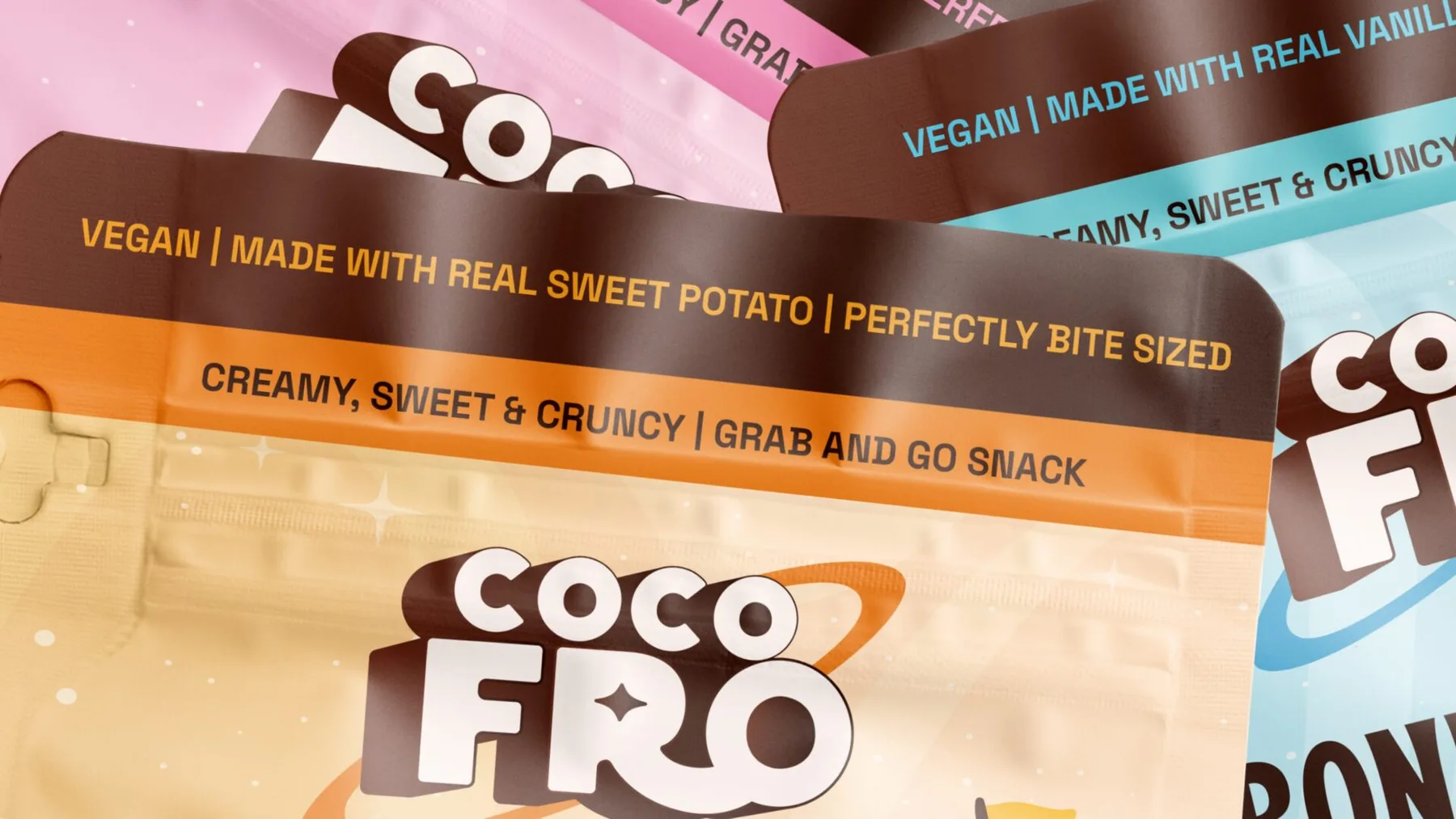 Close-up of layered CocoFro pouches showing the wordmark and flavour messages